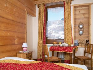 Ski chalet-hotel bedroom in traditional mountain style