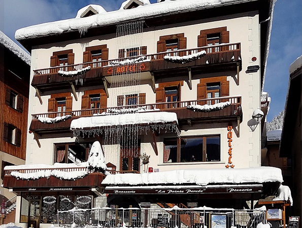 Snow-covered ski chalet-hotel