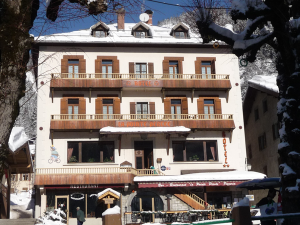 Hotel la Pointe Percee winter Outside of a ski chalet in the mountains covered in snow